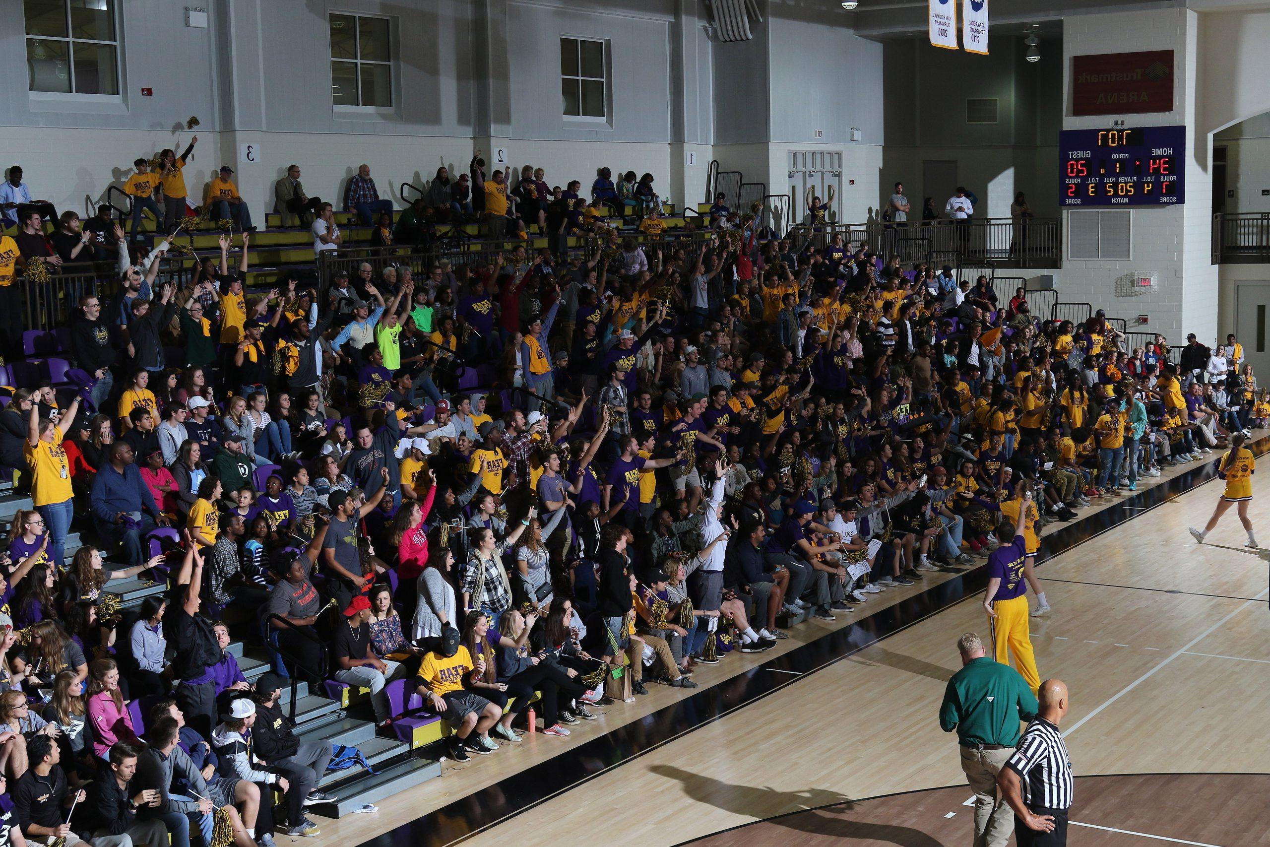 The crowd celebrates during a time out at a University of Montevallo basketball game.